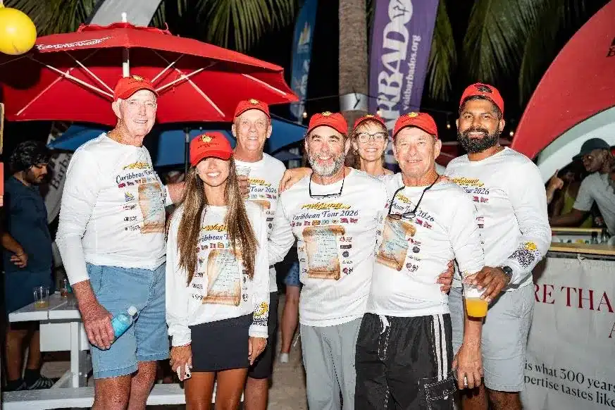 Sailors in Mount Gay Red Caps gathered at an evening event during Barbados Sailing Week 2026.